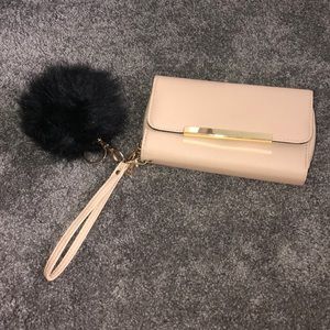 Pink clutch with pom
